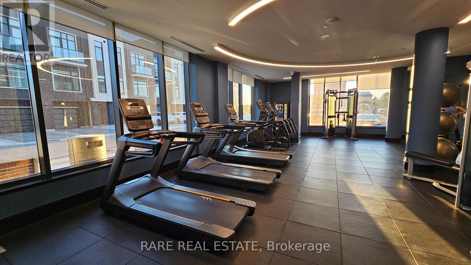 A gym with treadmills and exercise equipment.
