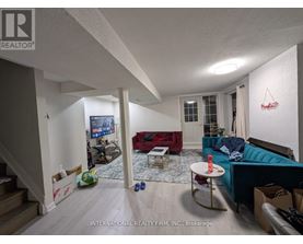 A living room with a couch, a television, and a coffee table.