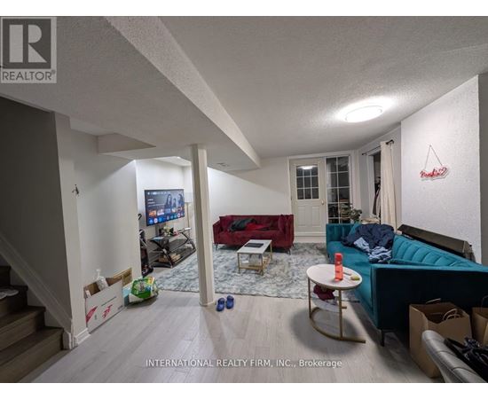 A living room with a couch, a television, and a coffee table.