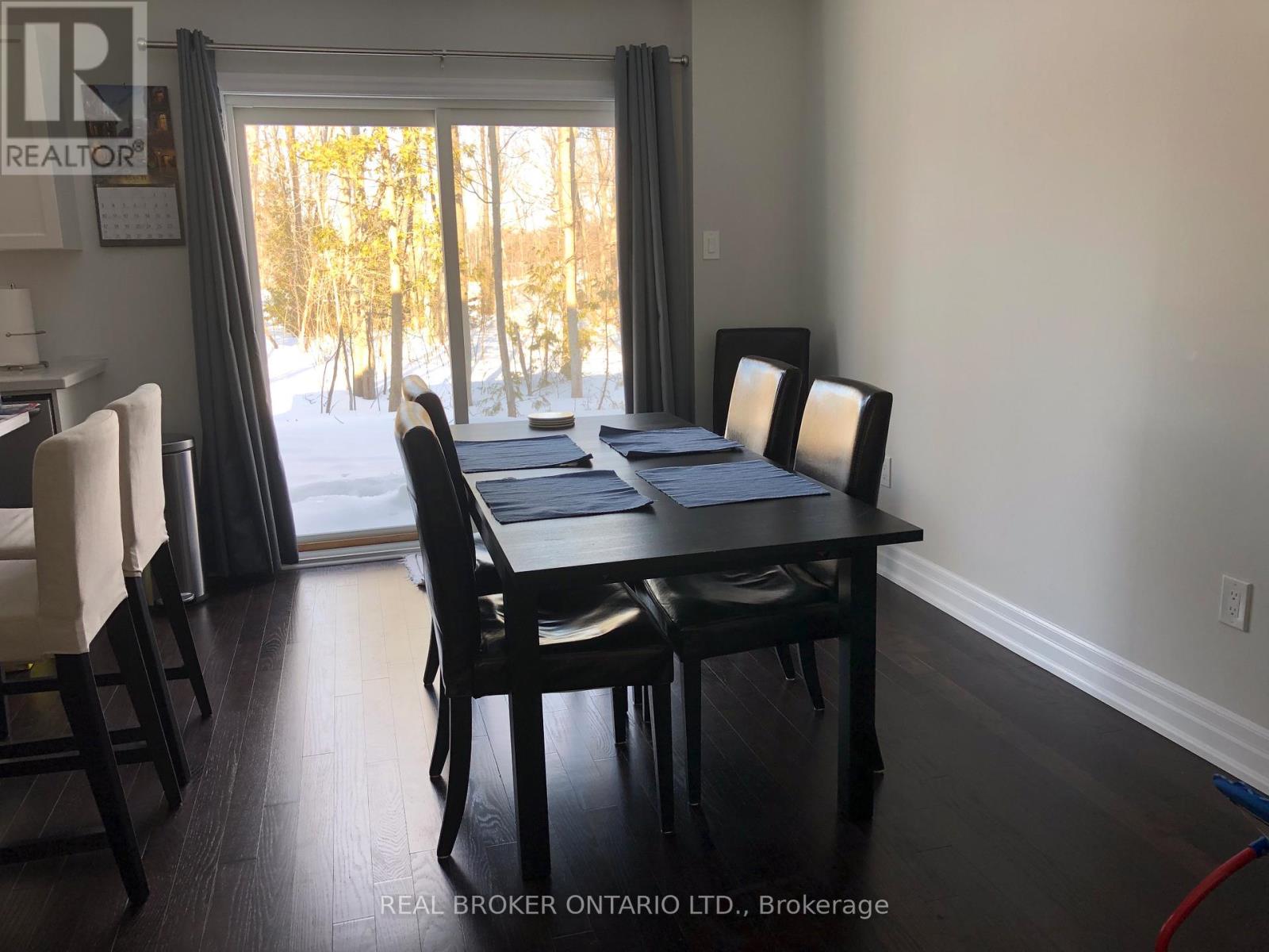 A dining room with a table and chairs is shown.