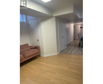 A living room with a couch and a chair.
