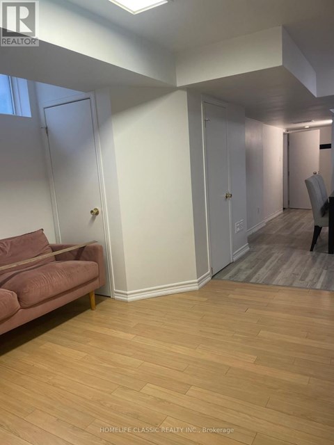 A living room with a couch and a chair.