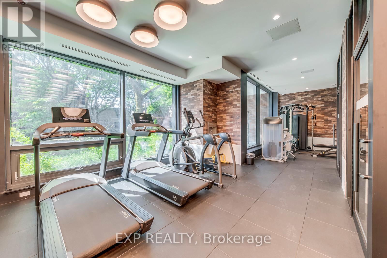 A gym with treadmills and exercise equipment is shown.