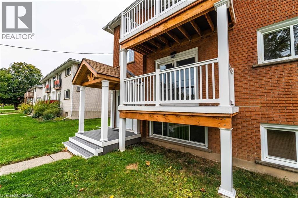 A house with a balcony and a REALTOR® logo.