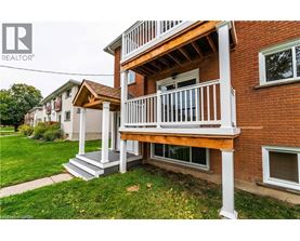 A house with a balcony and a REALTOR® logo.