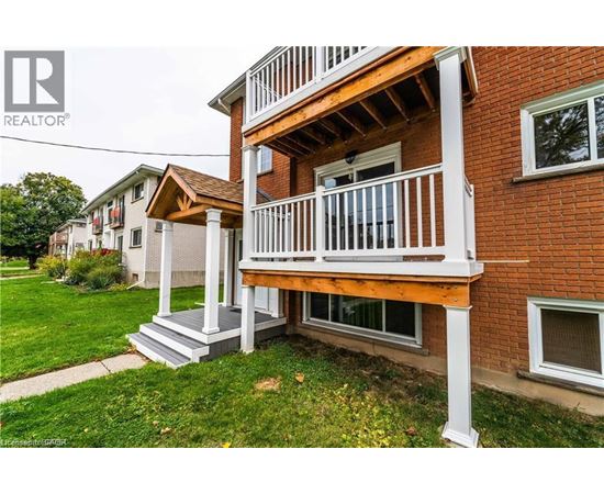 A house with a balcony and a REALTOR® logo.