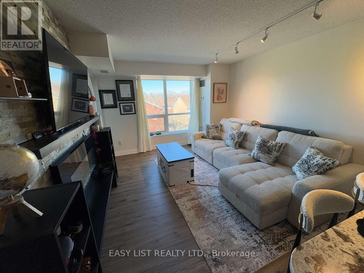 A living room with a grey couch and a flat screen TV.