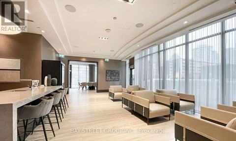 A modern living room with a long table and chairs.