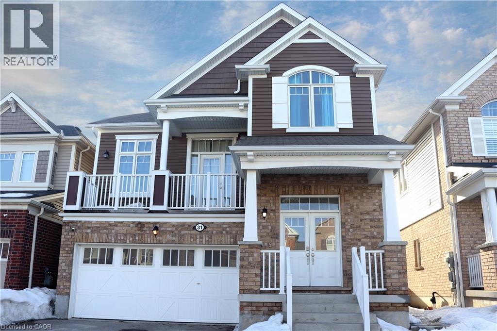 A house with a brown roof and a white garage door.