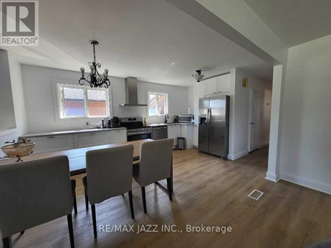 A dining room with a table set for four.
