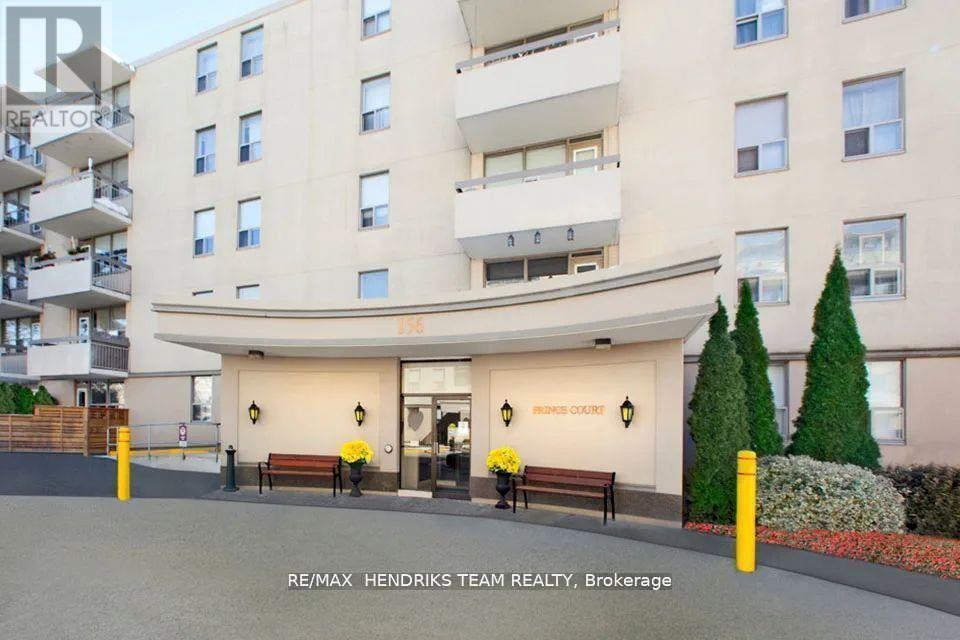 A building with the sign "RE/MAX HENDRICKS TEAM REALTY, Brokerage" in front of it.