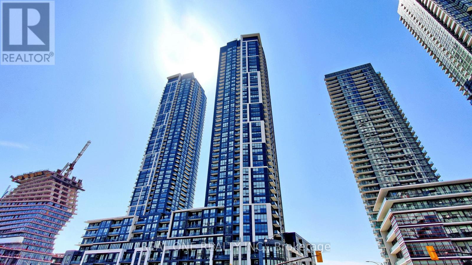 A cityscape with skyscrapers and a clear sky.