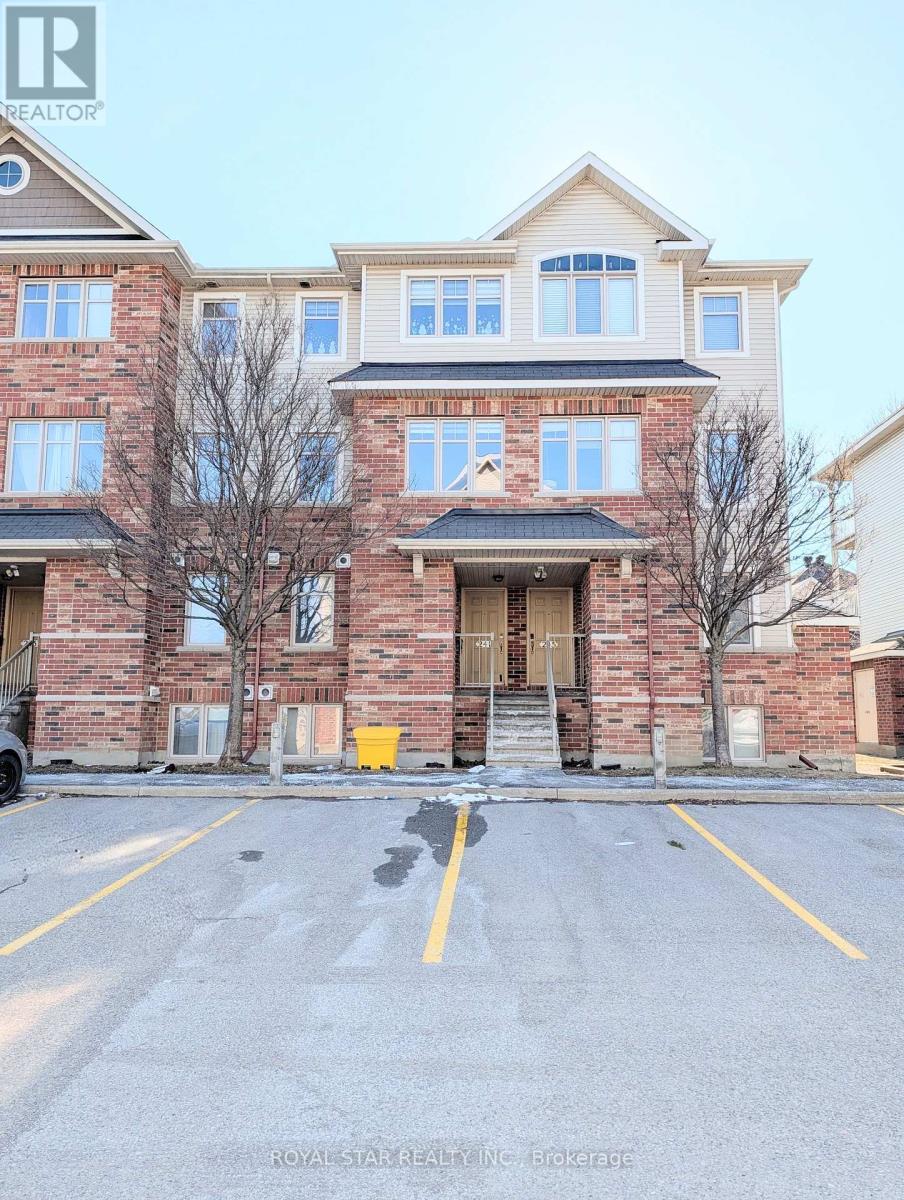 A building with a parking lot in front of it.
