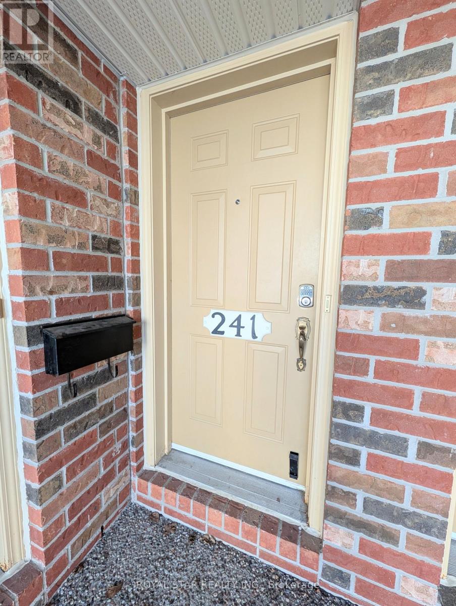 A white door with the number 241 on it.