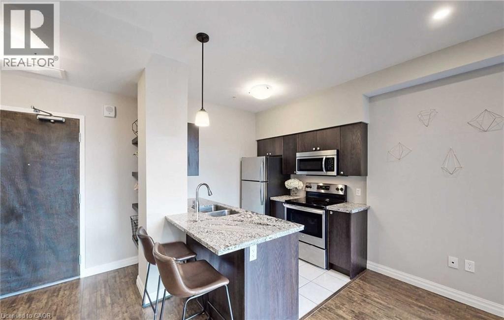 A modern kitchen with a dining table and chairs.