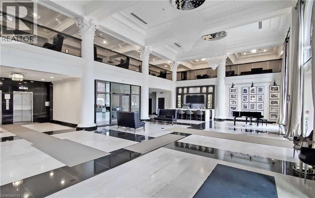 A spacious lobby with a white and black color scheme.