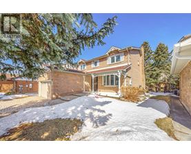 A house with a snow-covered front yard.