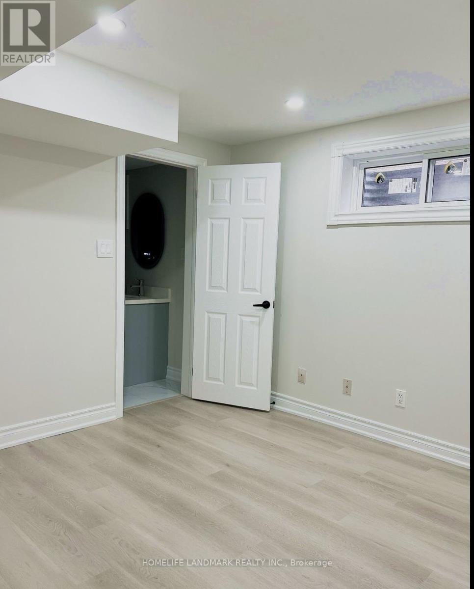 A room with a white door and a window.