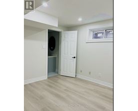 A room with a white door and a window.