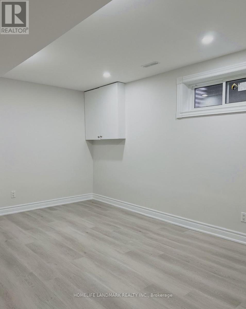 A room with a window and a cabinet built into the wall.