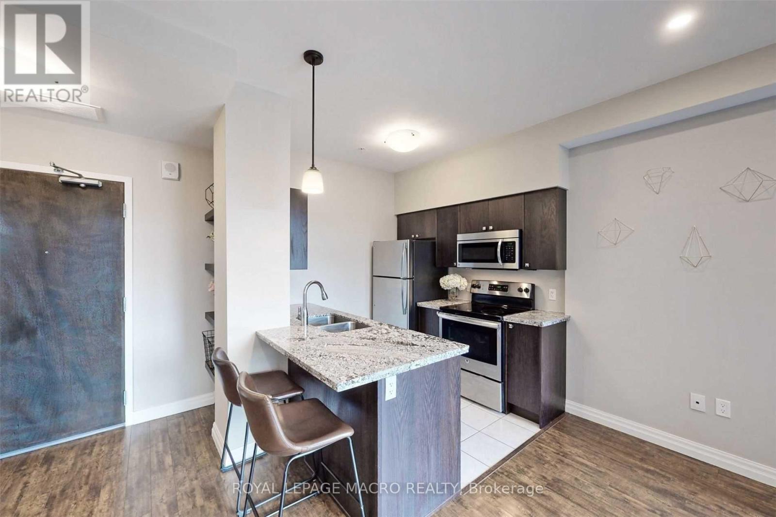 A modern kitchen with a dining table and chairs.