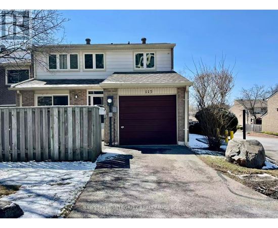 A two-story house with a garage and a driveway in front.