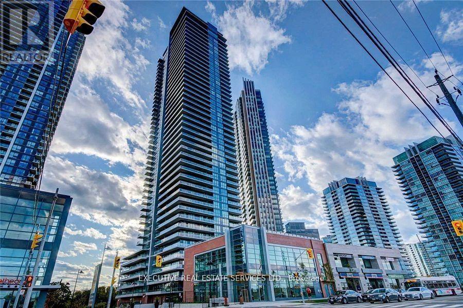 A cityscape with tall buildings and a clear sky.
