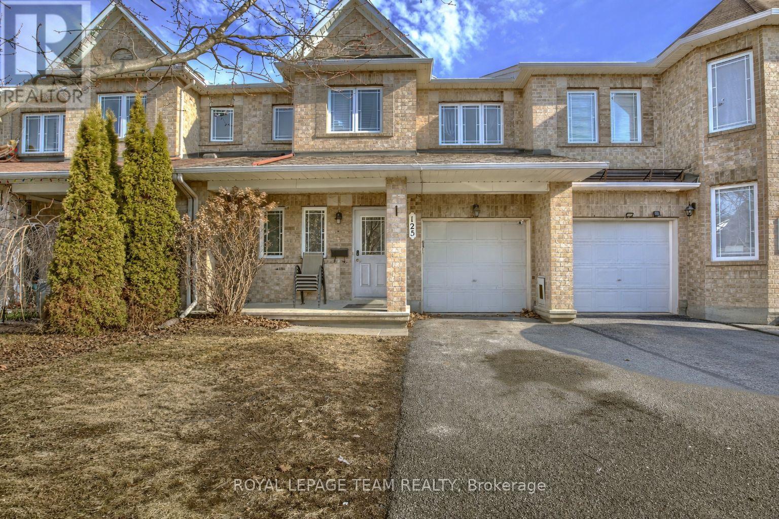 A large house with a driveway in front of it.