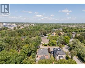 A bird's eye view of a residential area with houses and trees.