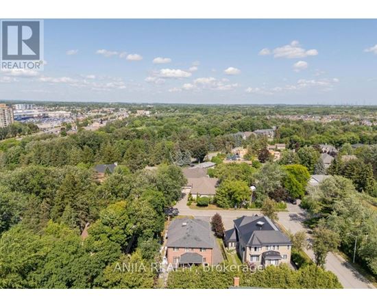 A bird's eye view of a residential area with houses and trees.