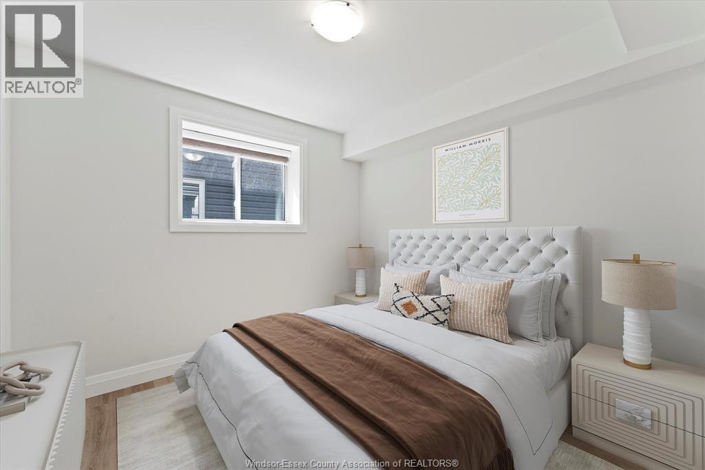 A bedroom with a large bed and a window.