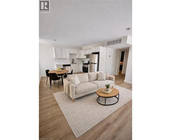 A modern living room with a white couch and a coffee table.