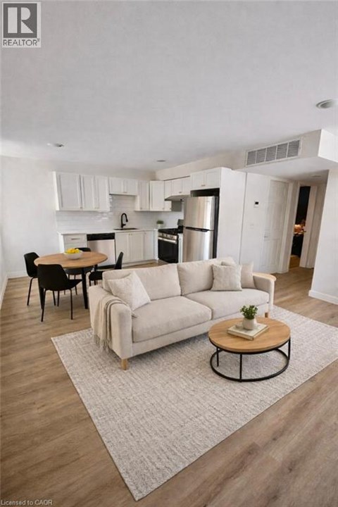 A modern living room with a white couch and a coffee table.