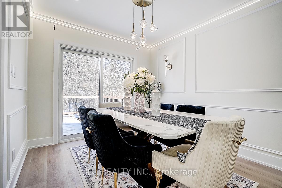 A dining room with a table set for four.
