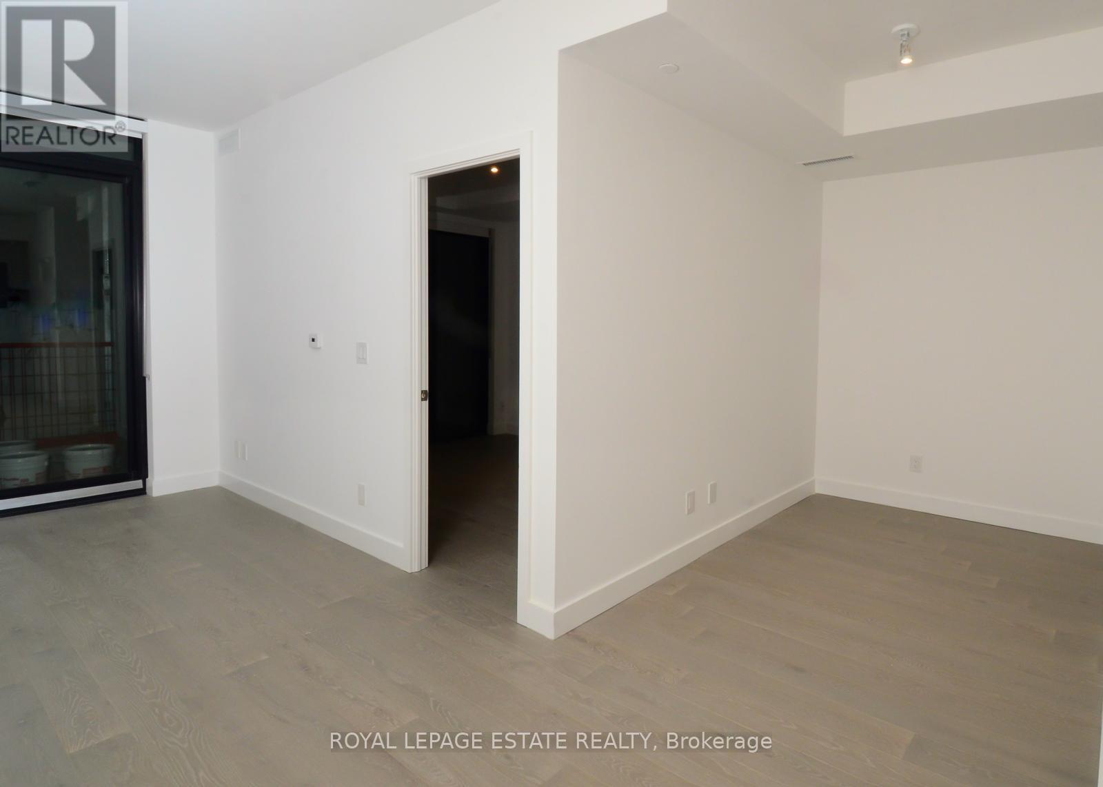 A room with a doorway leading to another room.
