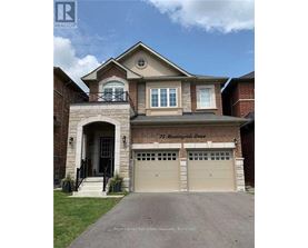A two-story house with a garage is for sale.