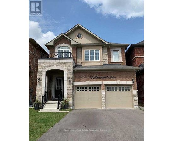 A two-story house with a garage is for sale.