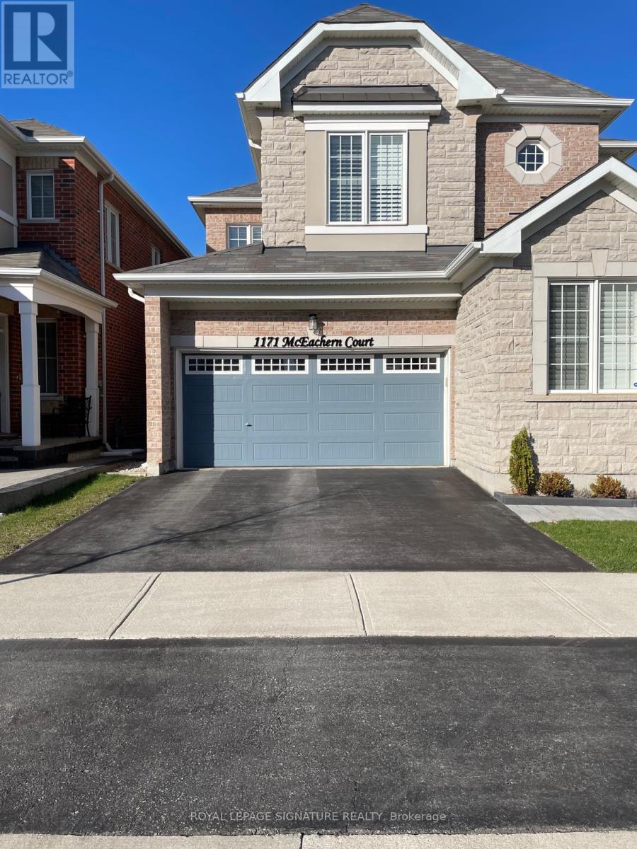 A house with a garage door that says 1171 Northern Court.