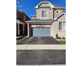 A house with a garage door that says 1171 Northern Court.