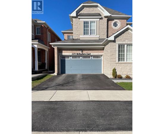 A house with a garage door that says 1171 Northern Court.