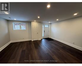 A room with wooden floors and white walls.