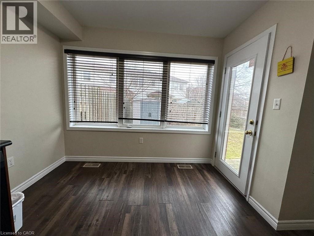 A room with a window and a door.