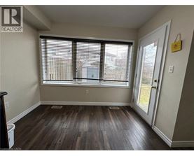 A room with a window and a door.