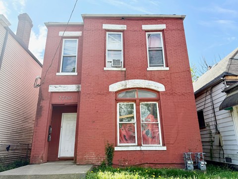 A red brick building with the number 2720 on the front.