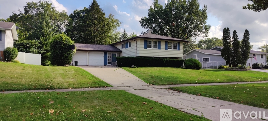 A house with a driveway in front of it is for sale.