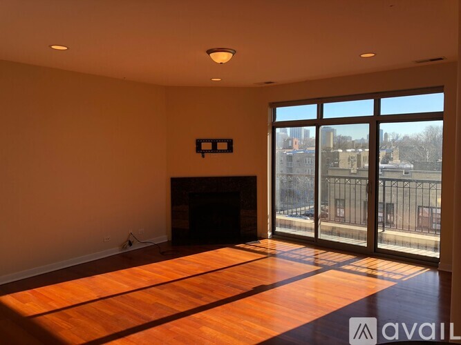 A room with a fireplace and sliding glass doors.