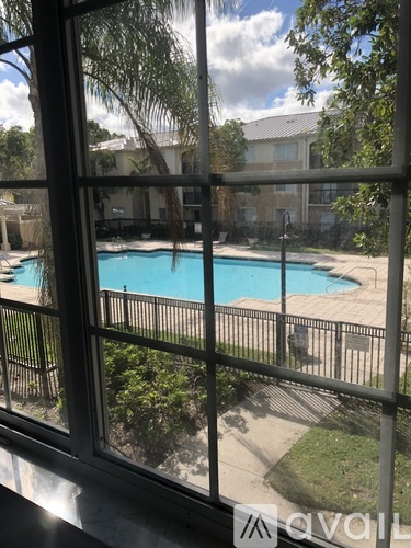 A pool seen through a window.
