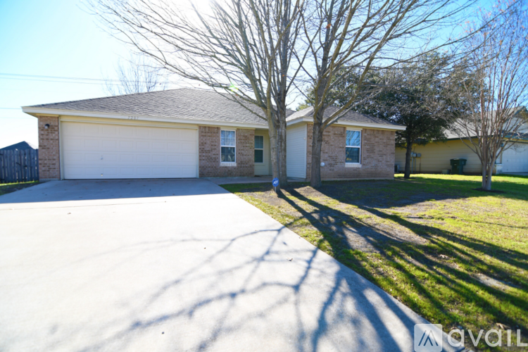 A house with a white garage door is for sale.