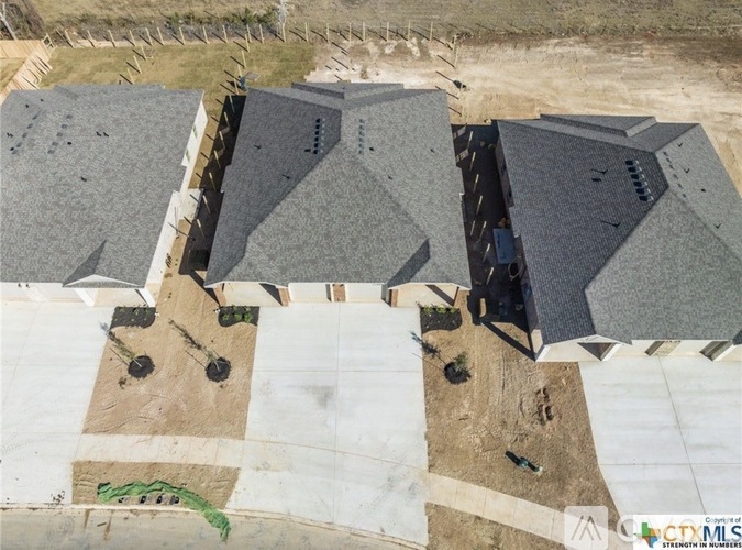 A construction site with a large building under construction.