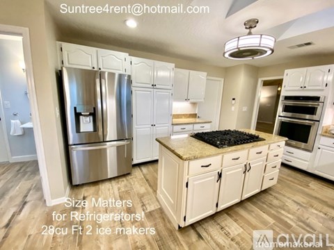 A kitchen with a message about the importance of refrigerator size.